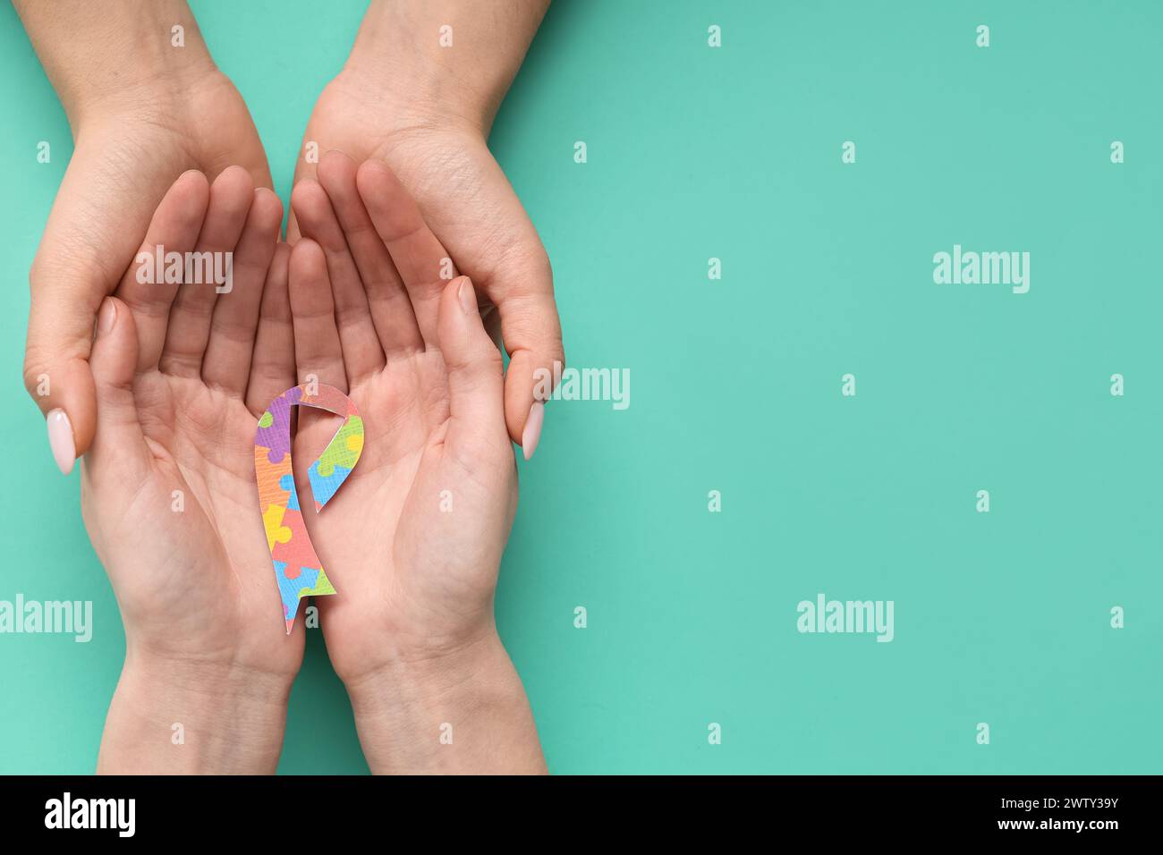 Female hands holding awareness hi-res stock photography and images - Alamy