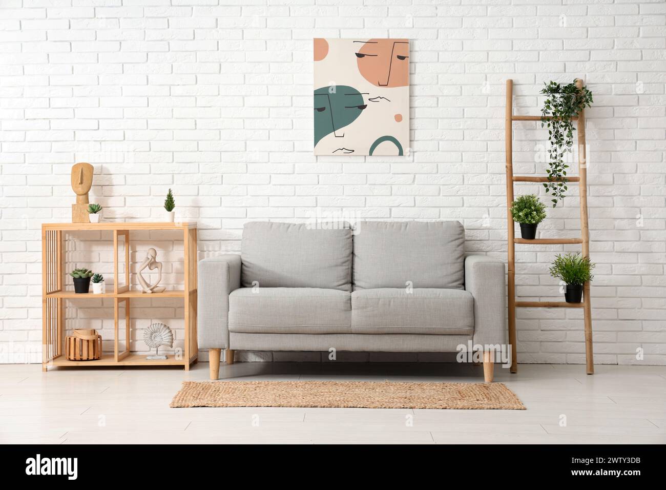 Stylish interior of modern living room with sofa Stock Photo - Alamy