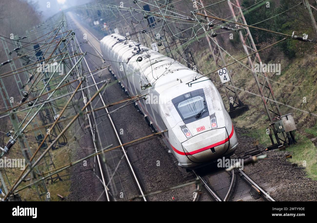 Eschede, Germany. 20th Mar, 2024. An ICE train travels on the railroad line between Hanover and Hamburg. Both sides in the wage dispute at Deutsche Bahn have resumed negotiations. According to a statement from Deutsche Bahn, the company and the train drivers' union GDL are confident of reaching an agreement this week. Credit: Julian Stratenschulte/dpa/Alamy Live News Stock Photo