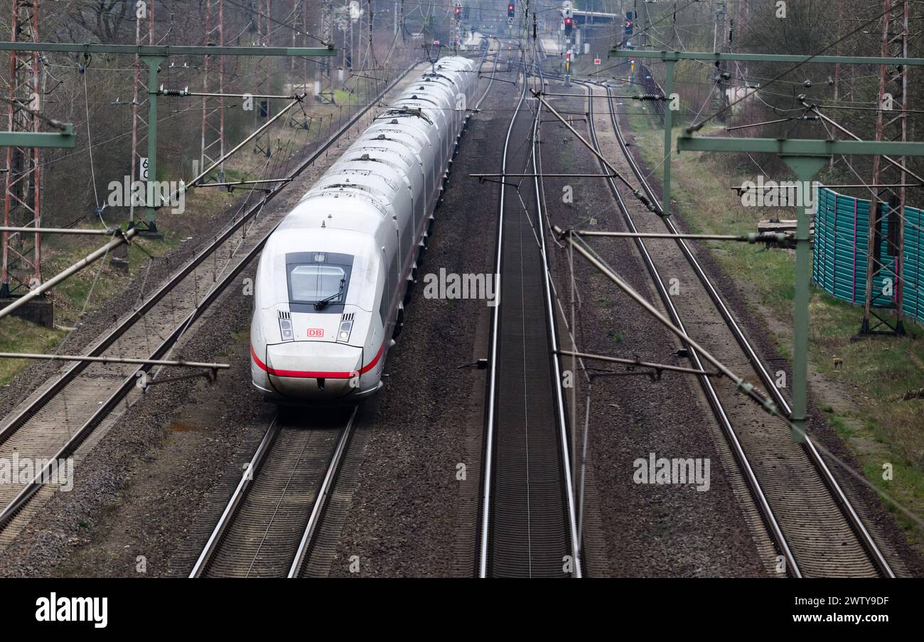 Eschede, Germany. 20th Mar, 2024. An ICE train travels on the railroad line between Hanover and Hamburg. Both sides in the wage dispute at Deutsche Bahn have resumed negotiations. The Group and the train drivers' union GDL are confident of reaching an agreement this week, according to a statement from Deutsche Bahn. Credit: Julian Stratenschulte/dpa/Alamy Live News Stock Photo