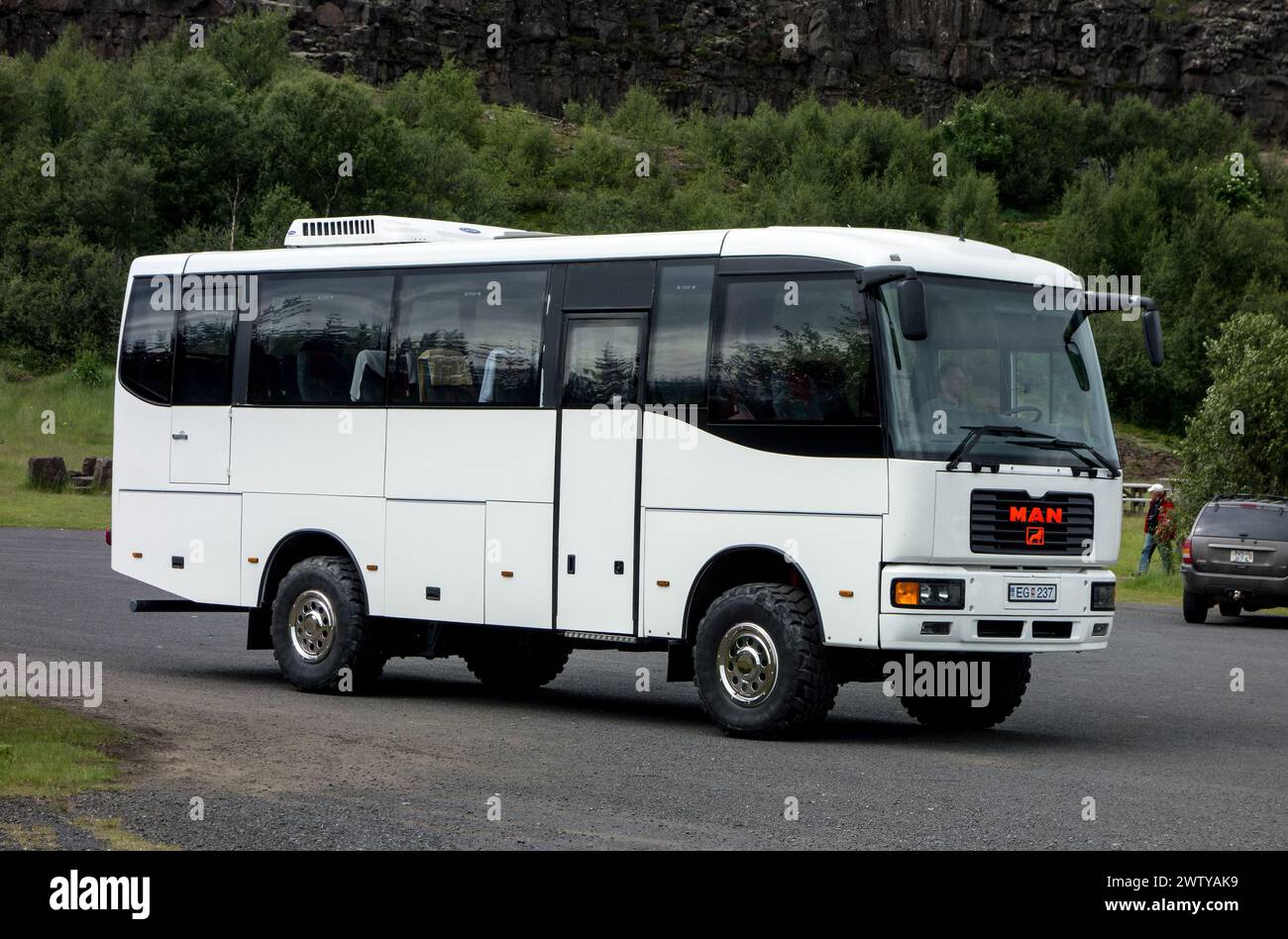 PINGVELLIR, ICELAND - JUNE 28, 2014: White MAN four wheel drive coach for offroad trips in the rough nature of Iceland Stock Photo