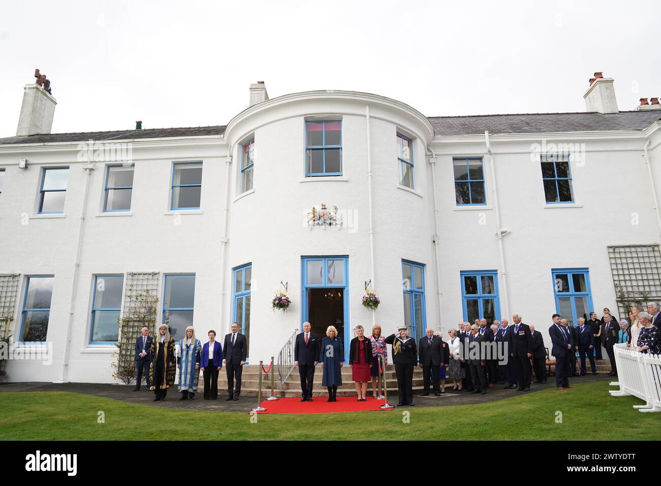 Queen Camilla (centre) during a visit to Government House, in Onchan, Isle of Man, where she is meeting community groups, and representatives from the RNLI and the Manx Bluetits swimming club. Picture date: Wednesday March 20, 2024. Stock Photo