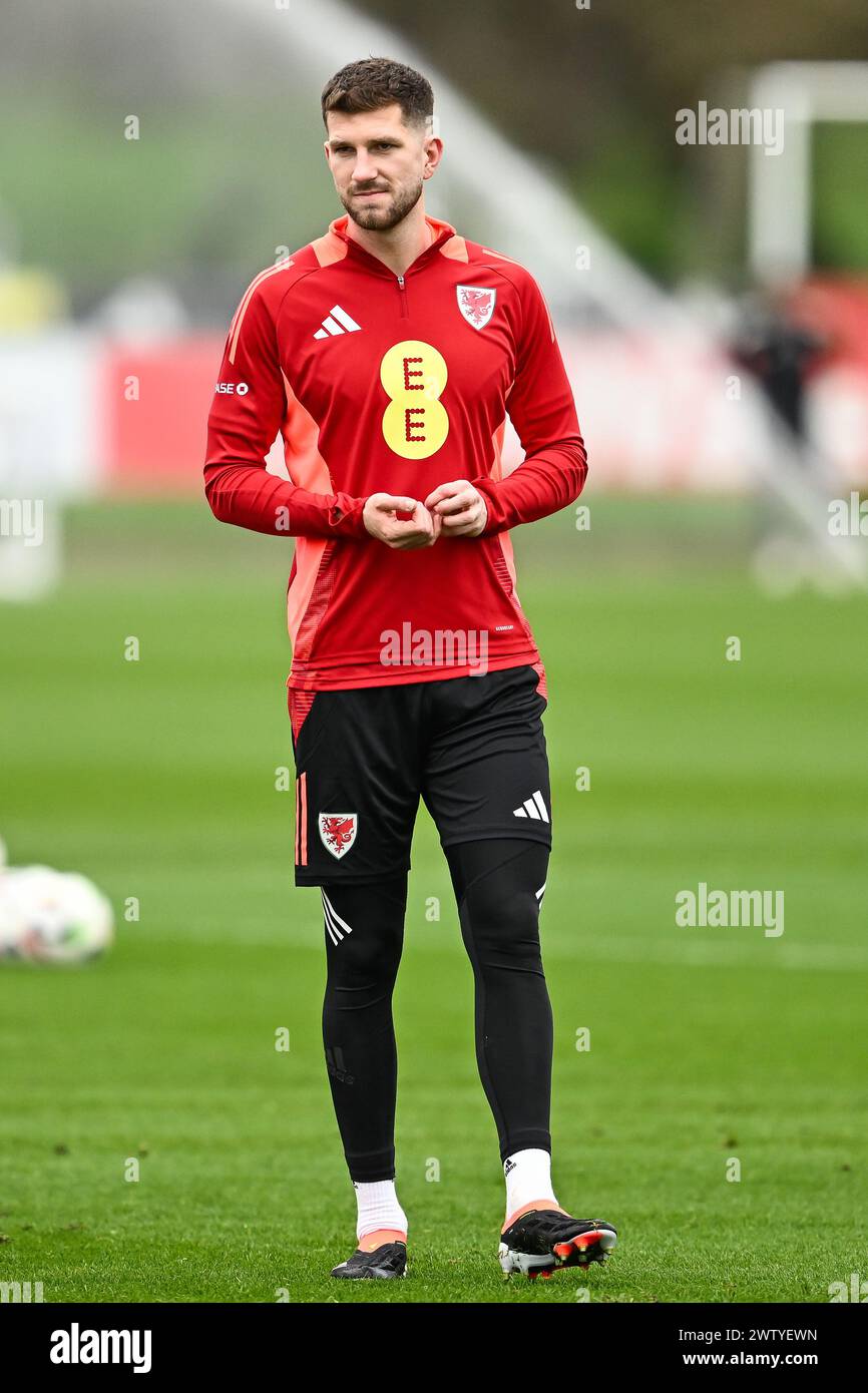 Chris Mepham of Wales during warms up ahead of the Wales open training session at Vale Resort Training complex, Hensol, United Kingdom, 20th March 2024  (Photo by Craig Thomas/News Images) Stock Photo