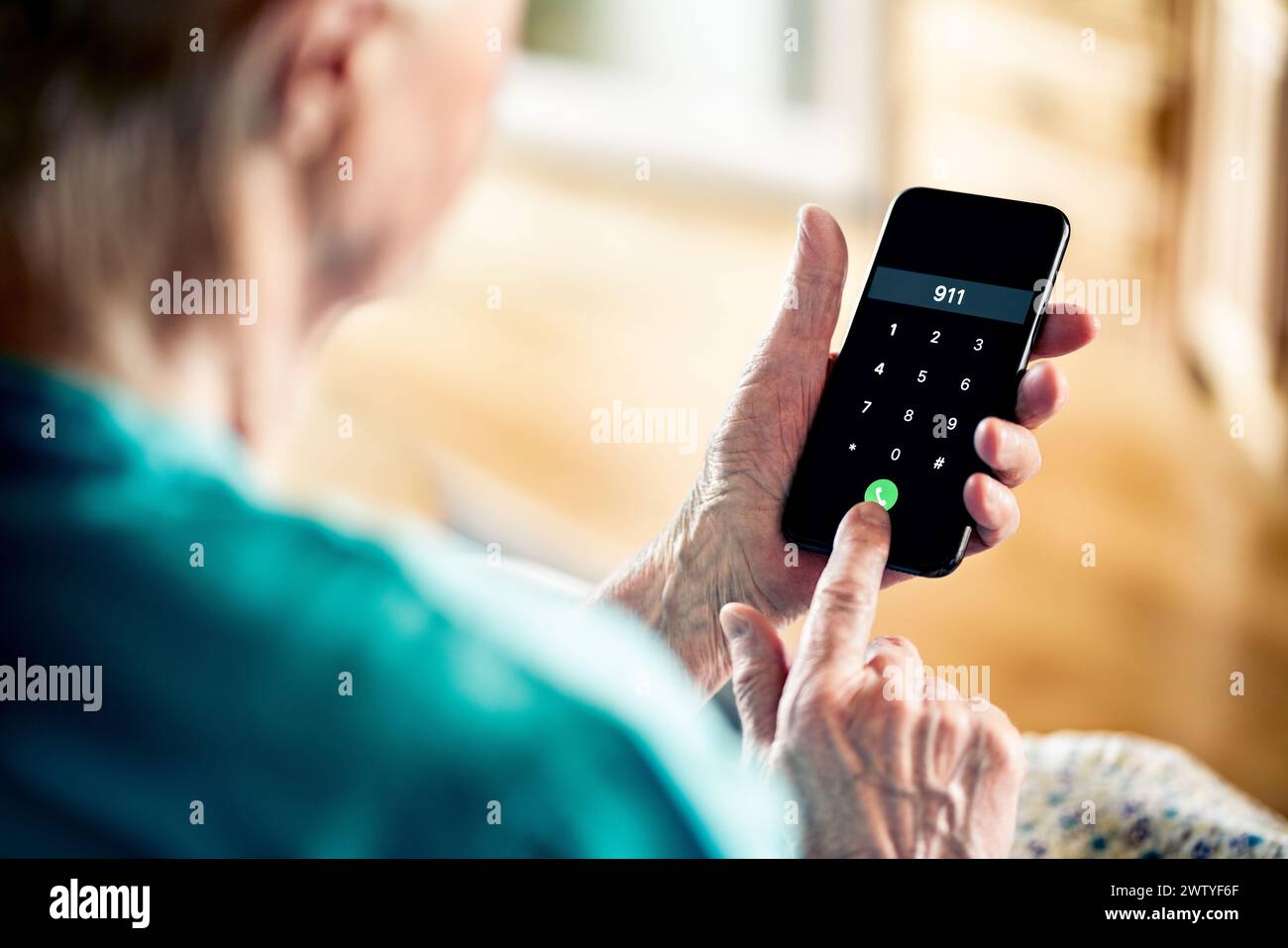 Phone call to emergency number 911. Old senior woman. Heart attack, medical injury or fire. Police hotline. Hospital assistance, paramedic or doctor. Stock Photo