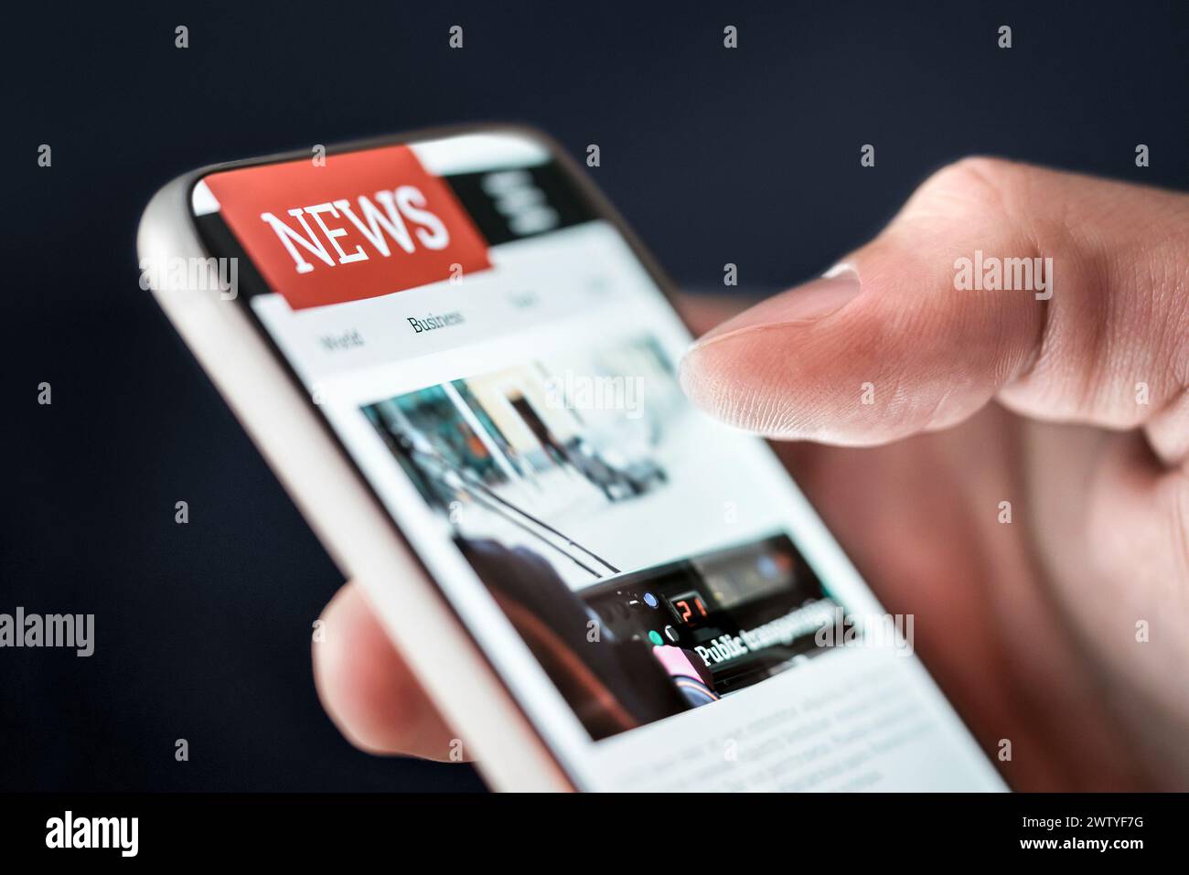 News in phone. Online newspaper article. Digital press publication. Reading latest headlines on digital mobile publication website or app. Stock Photo