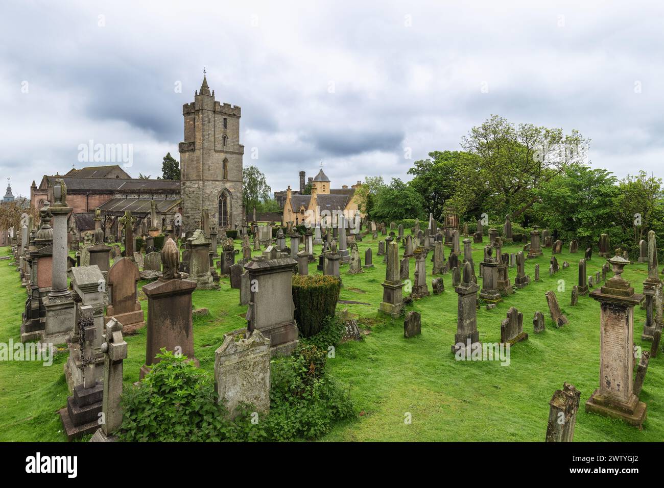 Cemetery of the Holy Rude Church in Stirling, Scotland, its ancient gravestones dotting the lush greenery, evoking a sense of history and serenity Stock Photo