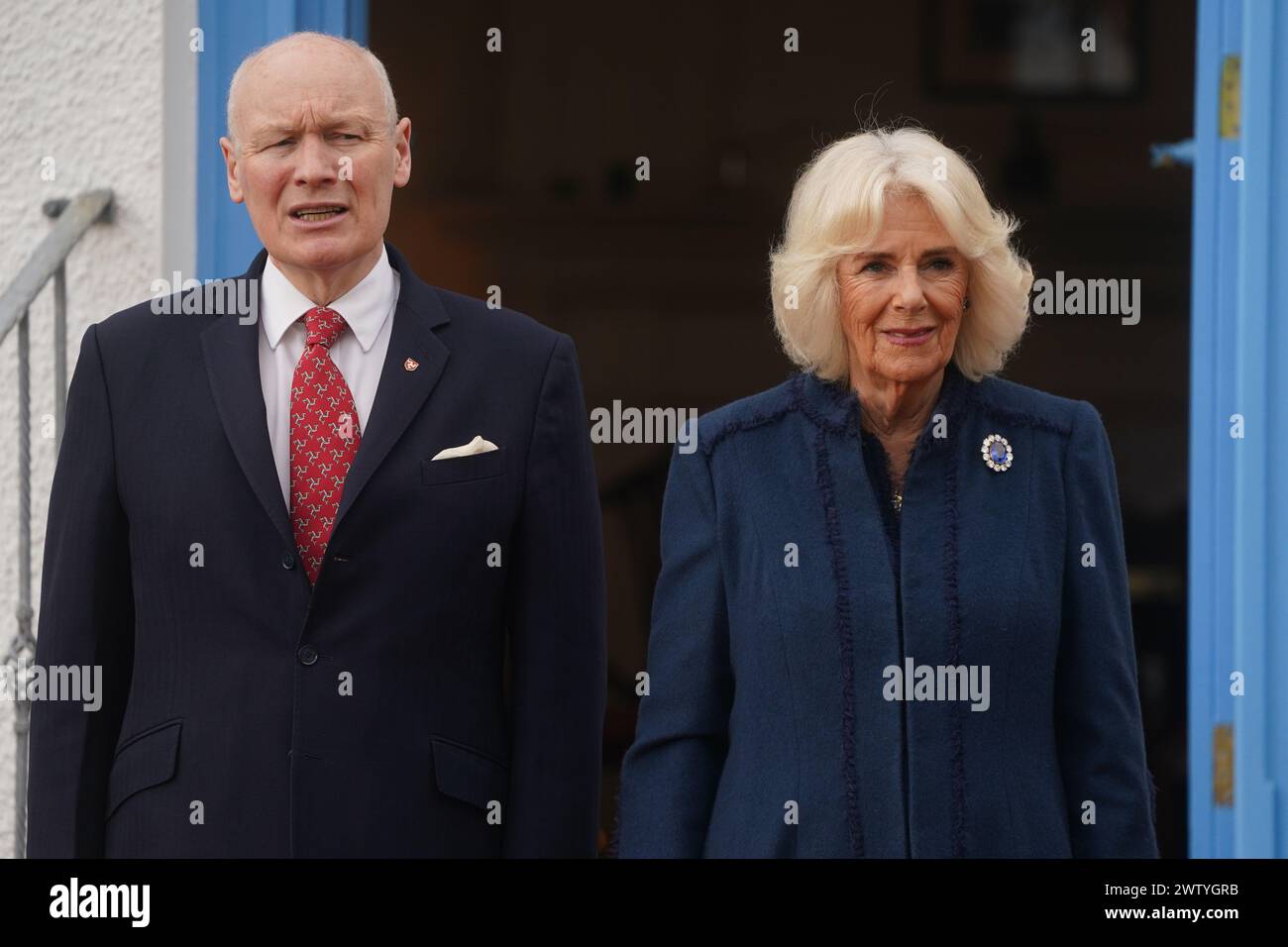 Queen Camilla with Lieutenant Governor Isle of Man, Sir John Lorimer during a visit to Government House, in Onchan, Isle of Man, where she is meeting community groups, and representatives from the RNLI and the Manx Bluetits swimming club. Picture date: Wednesday March 20, 2024. Stock Photo