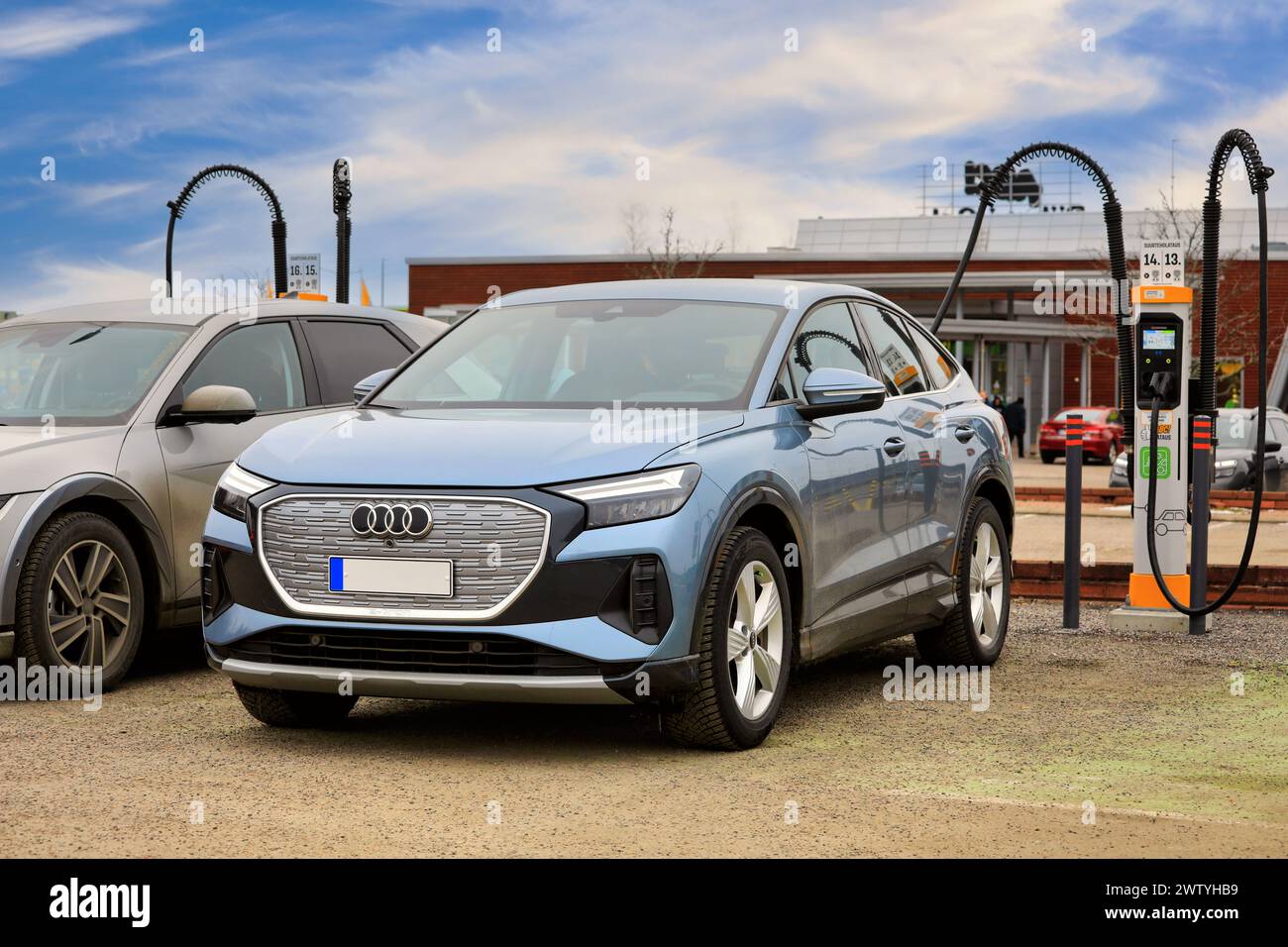 Ice blue Audi Q4 Sportback 40 etron fully electric car charging