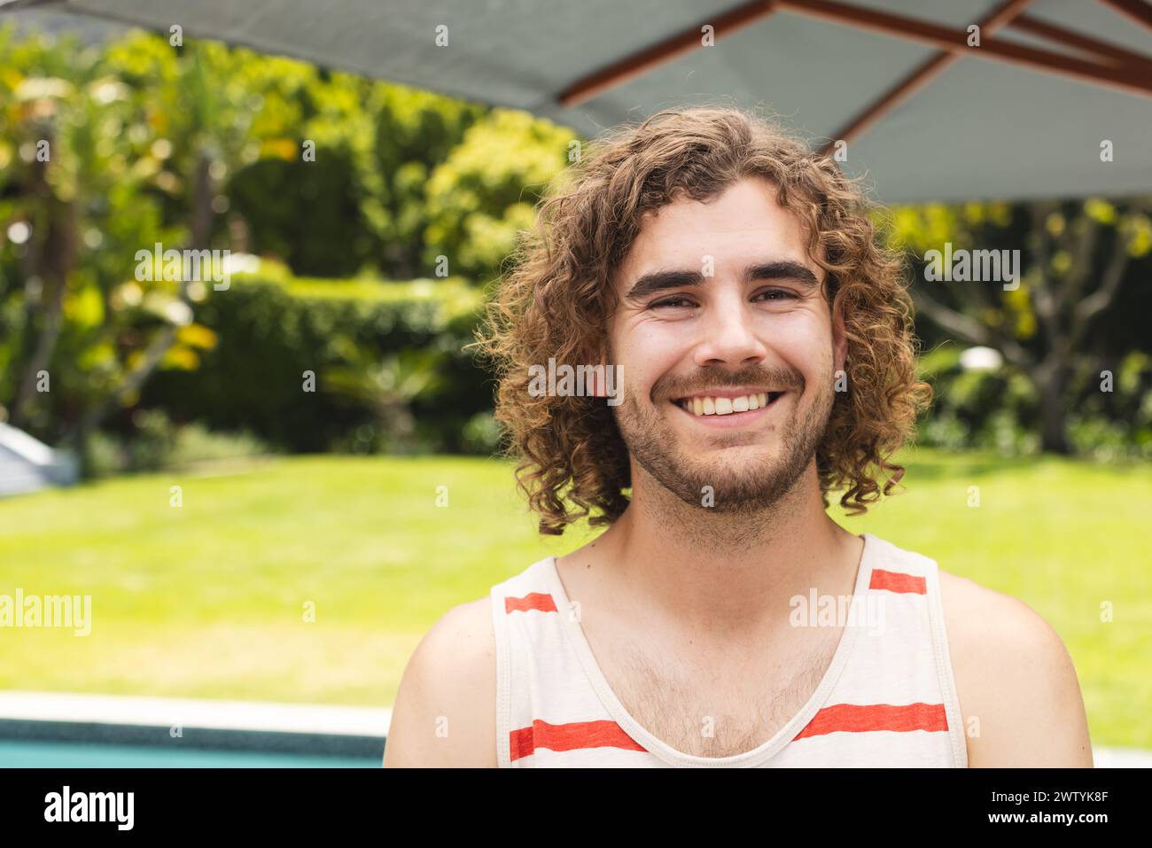 Man with curly hair and beard hi-res stock photography and images - Alamy