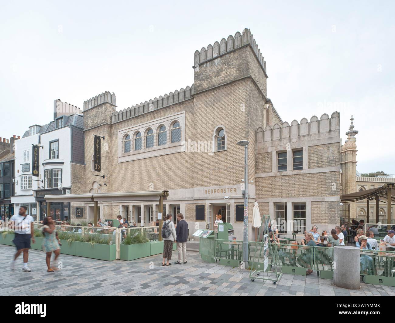 Refurbished building facade and outdoor cafe. Brighton Dome Corn ...