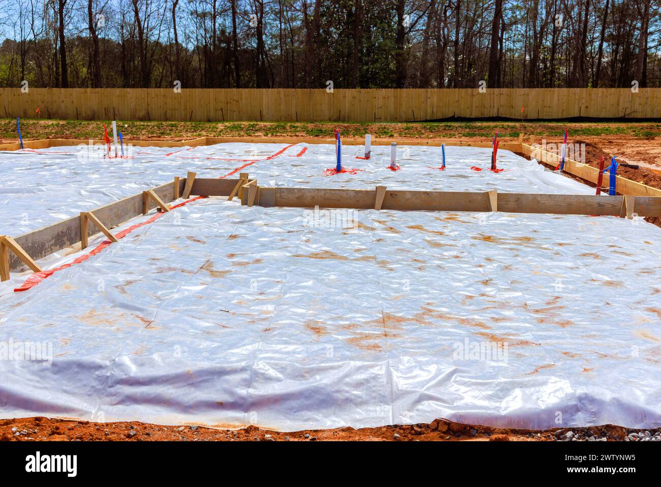 Before pouring foundation of house, ground is covered with first layer insulation waterproofing Stock Photo