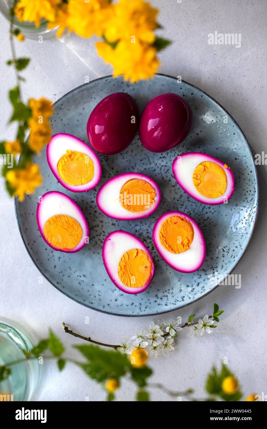 Hard boiled eggs pickled in beetroot juice Stock Photo