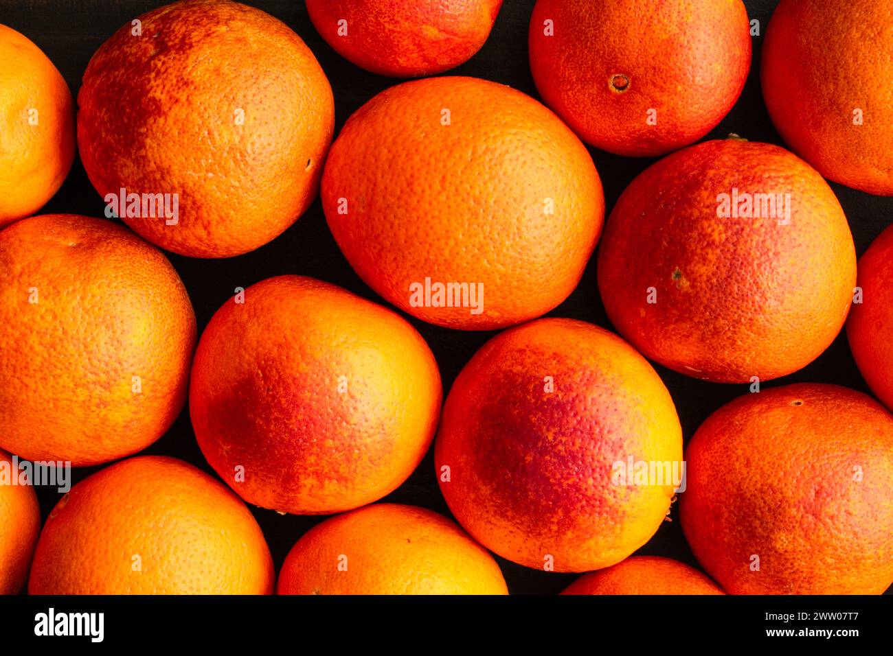 Group of Blood Oranges Viewed from Overhead: Group of whole raspberry ...