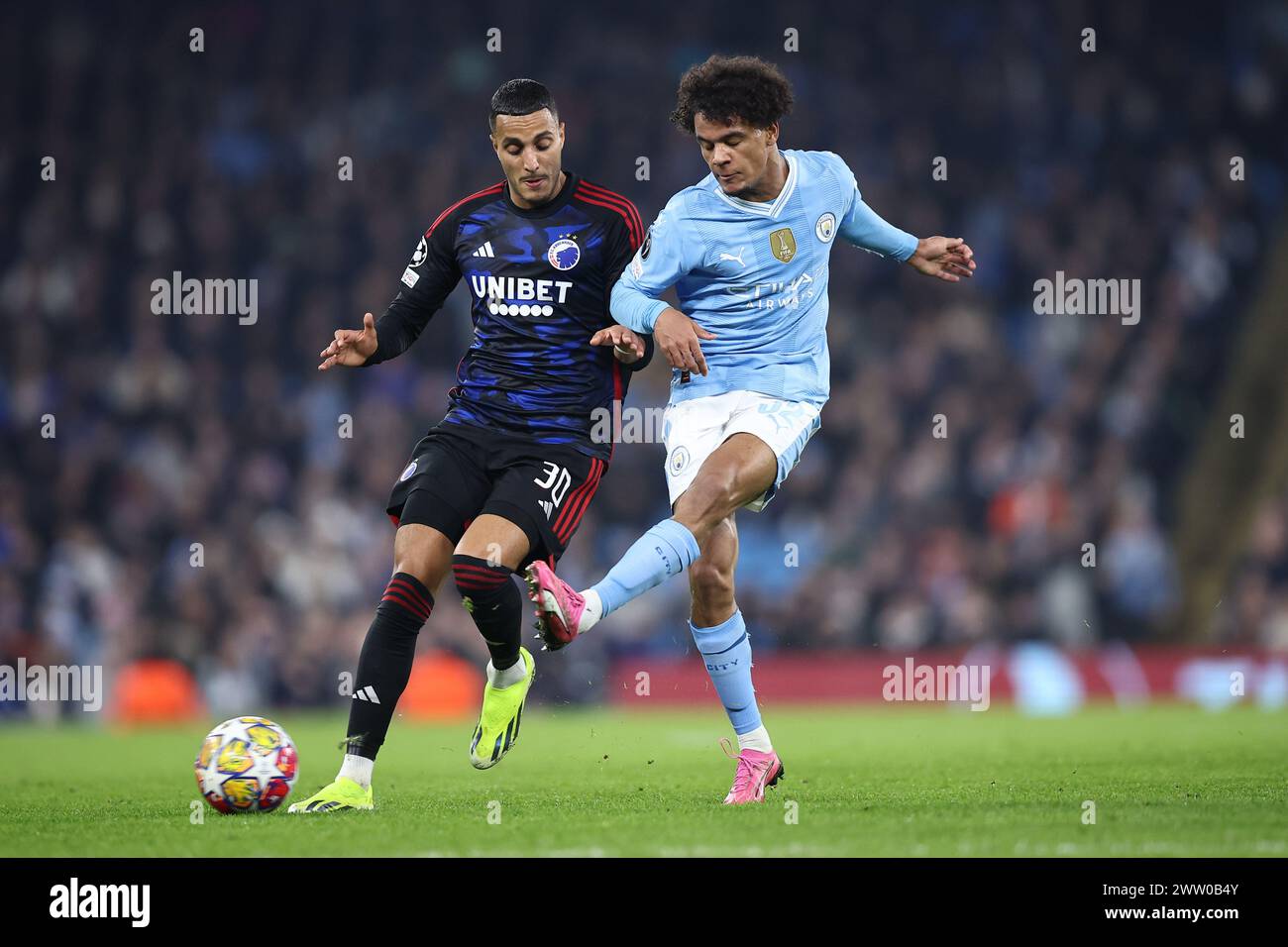 oscar-bobb-of-manchester-city-and-elias-achouri-of-fc-copenhagen-during