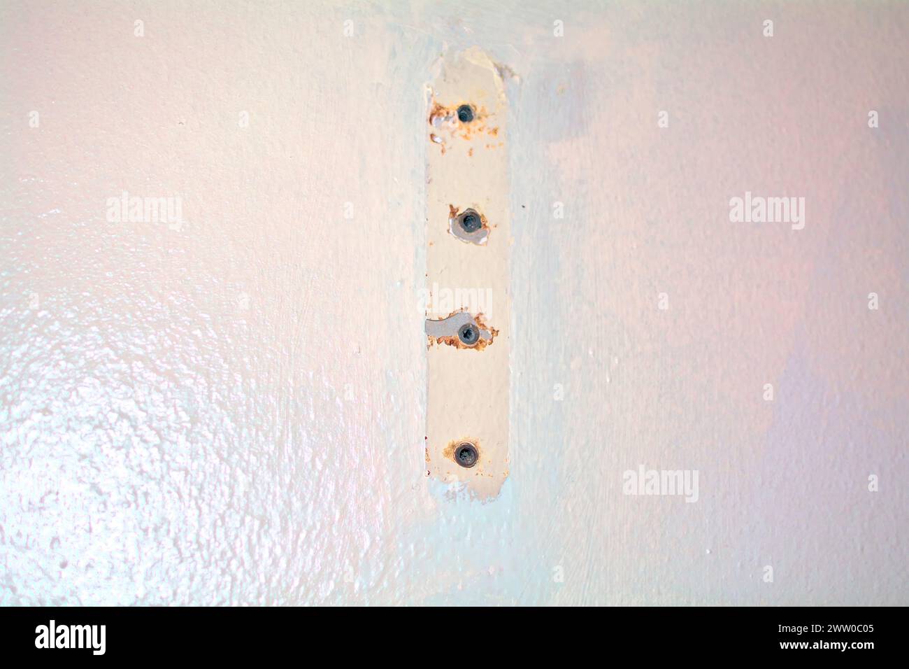 White wall with rust marks. Stock Photo