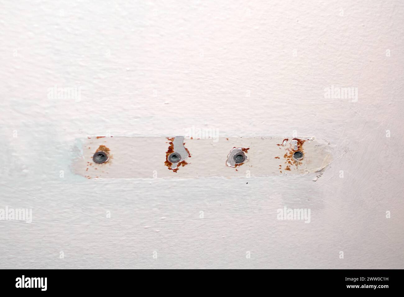 Irregular texture and noticeable discoloration on a wall. Stock Photo