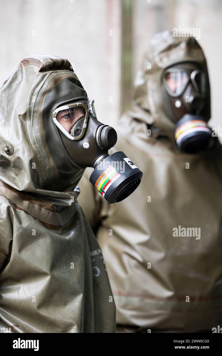 20 March 2024, Lower Saxony, Munster Two employees in NBC protective