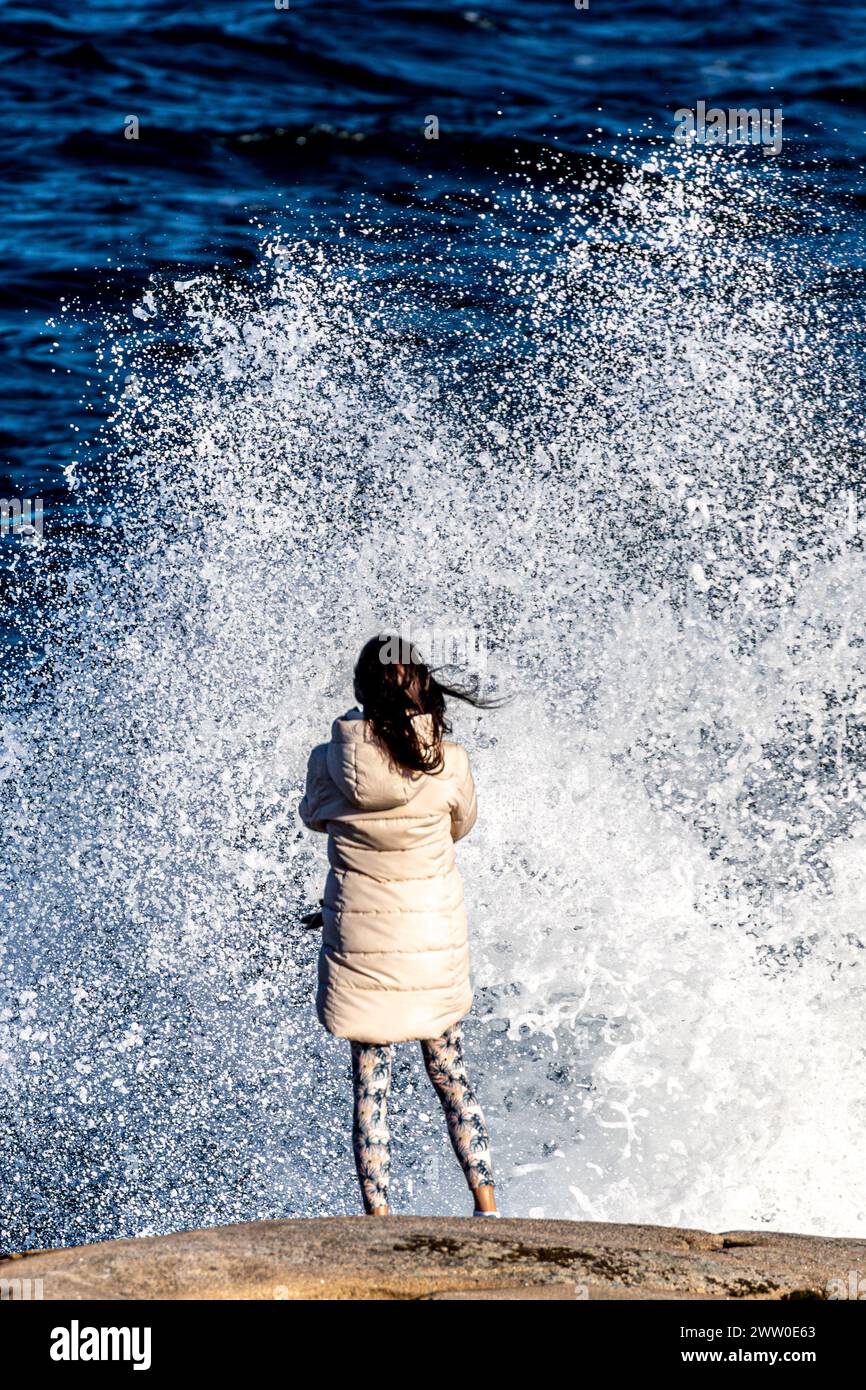 Woman standing sea on windy hi-res stock photography and images - Alamy