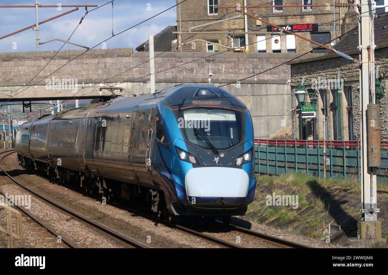 TransPennine Express civity electric multiple unit, Carnforth on West Coast Main Line Railway, 20th March 2024, with Manchester Airport train. Stock Photo
