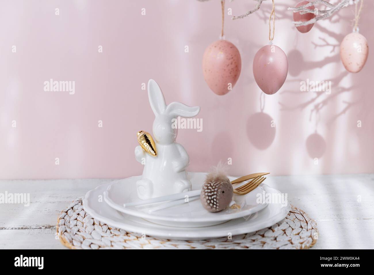 Easter Bunny Figurine With Table place setting Stock Photo