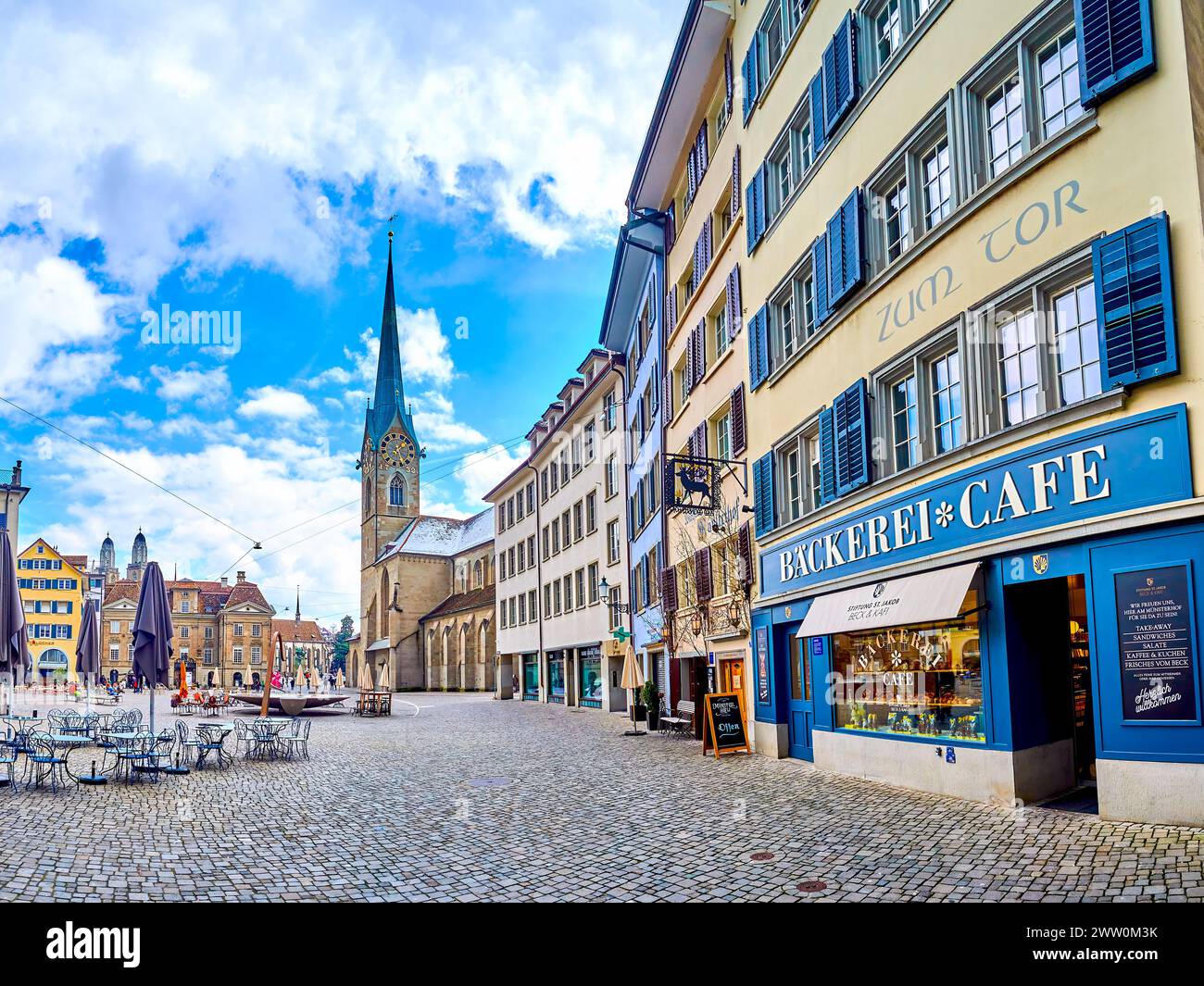 ZURICH, SWITZERLAND - APRIL 3, 2022: Munsterhof square with stunning Fraumunster church, on April 3 in Zurich, Switzerland Stock Photo