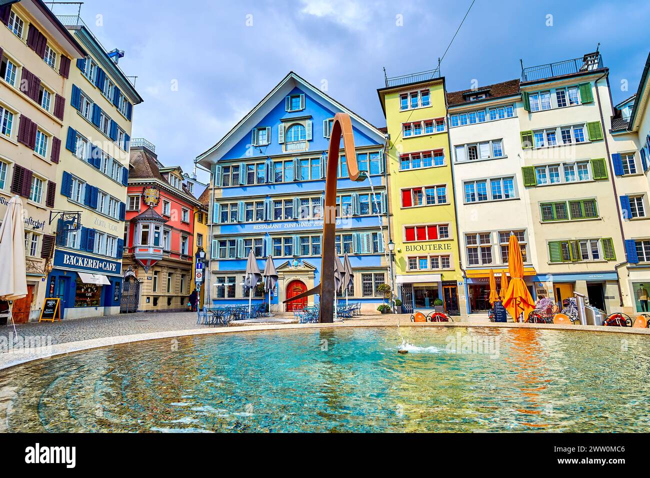 ZURICH, SWITZERLAND - APRIL 3, 2022: Munsterhof Brunnen, the fountain amidst Munsterhof's historic townhouses, on April 3 in Zurich, Switzerland Stock Photo
