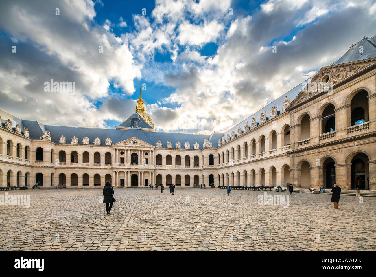 A large courtyard with a clock tower at Les Invalides in Paris, France. Stock Photo
