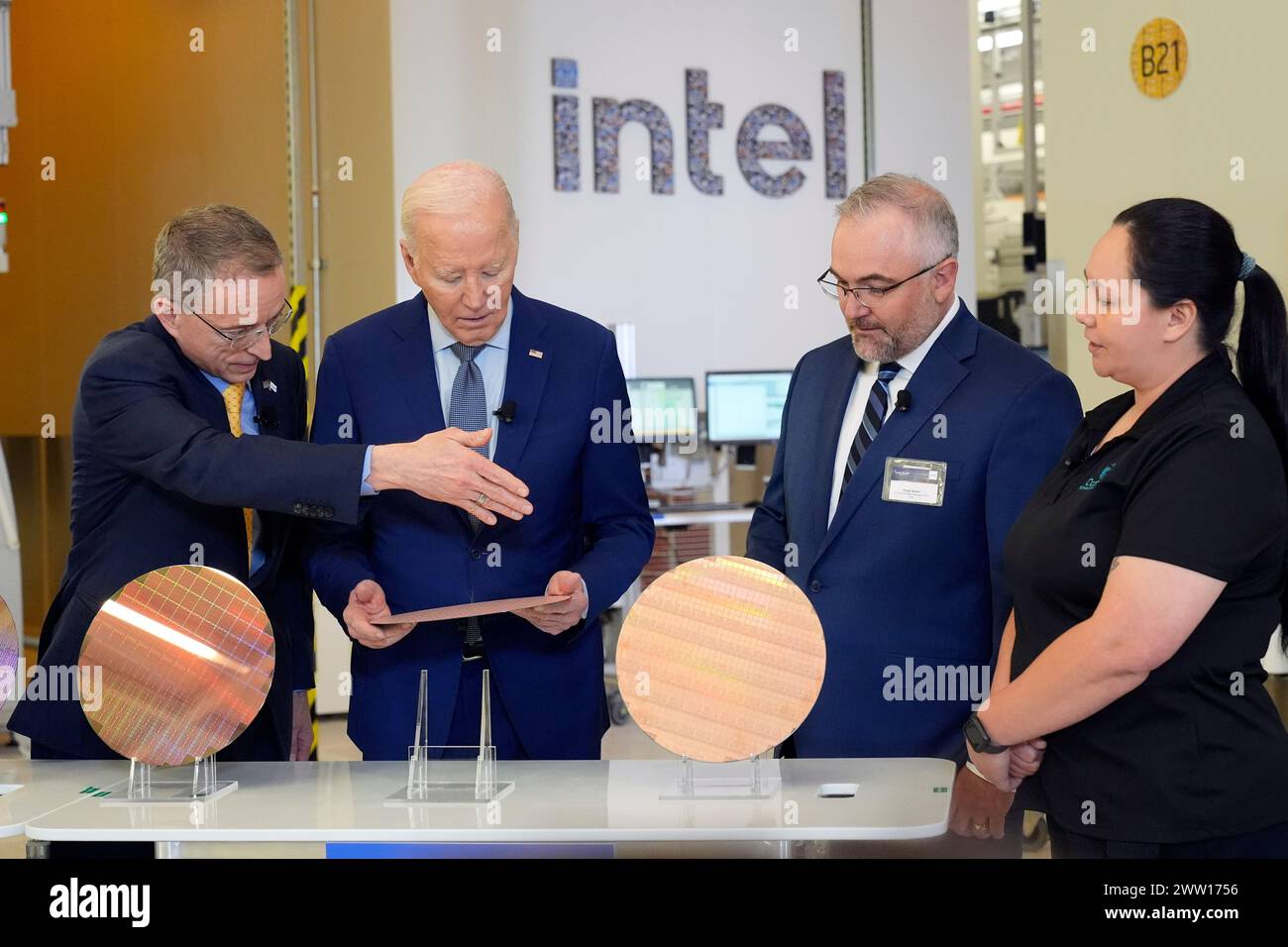 President Joe Biden listens to Intel CEO Pat Gelsinger, left, as Intel ...