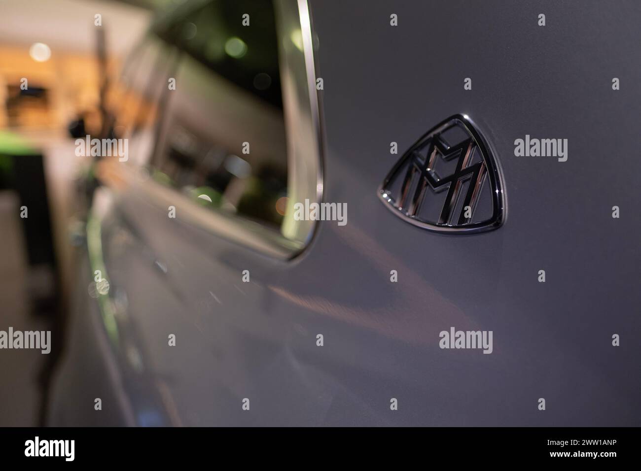closeup badge logo electric silver Maybach GLS SUV, EV Mercedes-Benz Group, environmental cleanliness vehicle, Innovation in automotive industry show Stock Photo