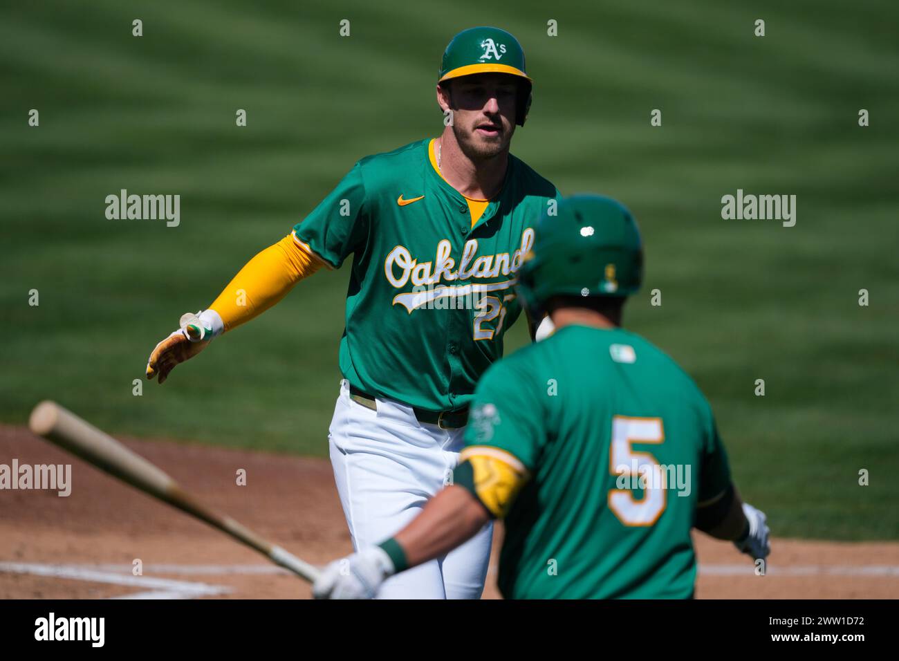Oakland Athletics' Brent Rooker greets J.D. Davis (5) after hitting a