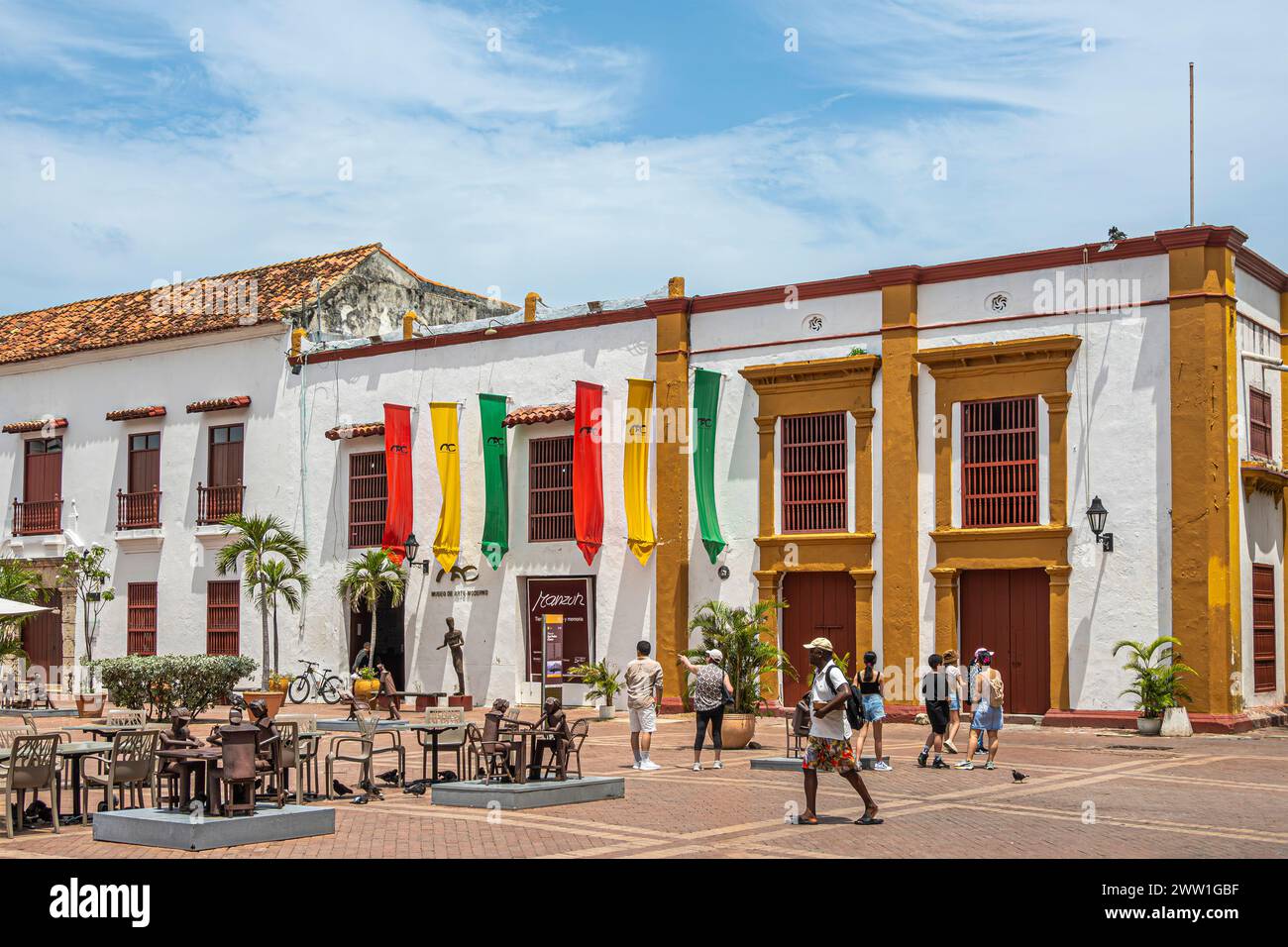 Cartagena, Colombia - July 25, 2023: Plaza de San Pedro Claver, square. Museo del arte moderno, modern art museum with flags, metal artwork and coloni Stock Photo