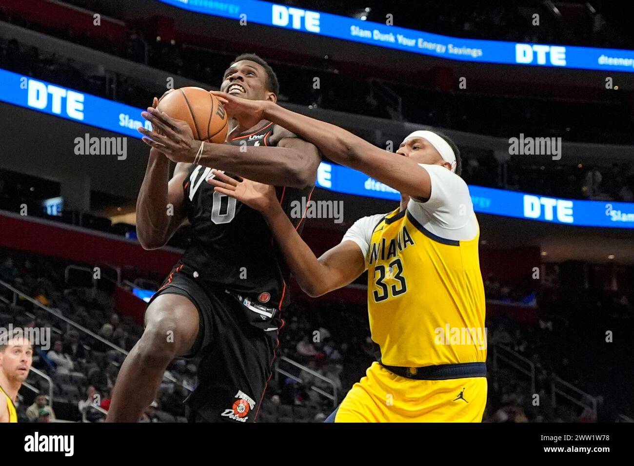 Detroit Pistons center Jalen Duren (0) is fouled by Indiana Pacers center Myles Turner (33) during the second half of an NBA basketball game, Wednesday, March 20, 2024, in Detroit. (AP Photo/Carlos Osorio) Stock Photo