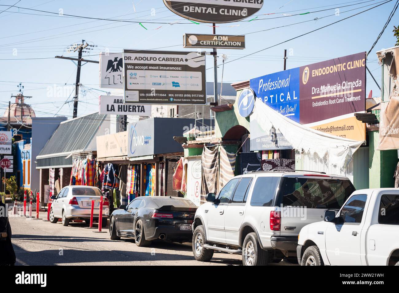 Dental offices, pharmacies, and opticians on the street at Los