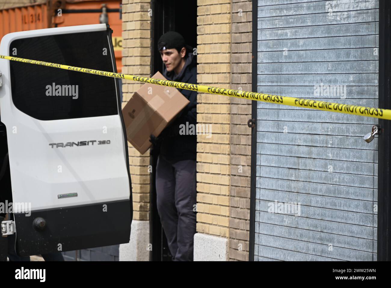 FBI agents load boxes of evidence collected from a warehouse into a