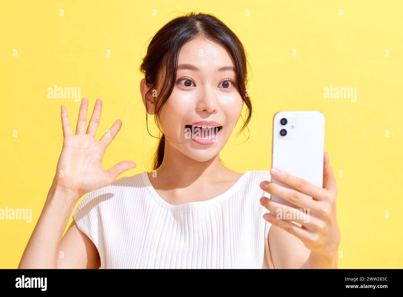 Asian woman taking selfie with smartphone Stock Photo