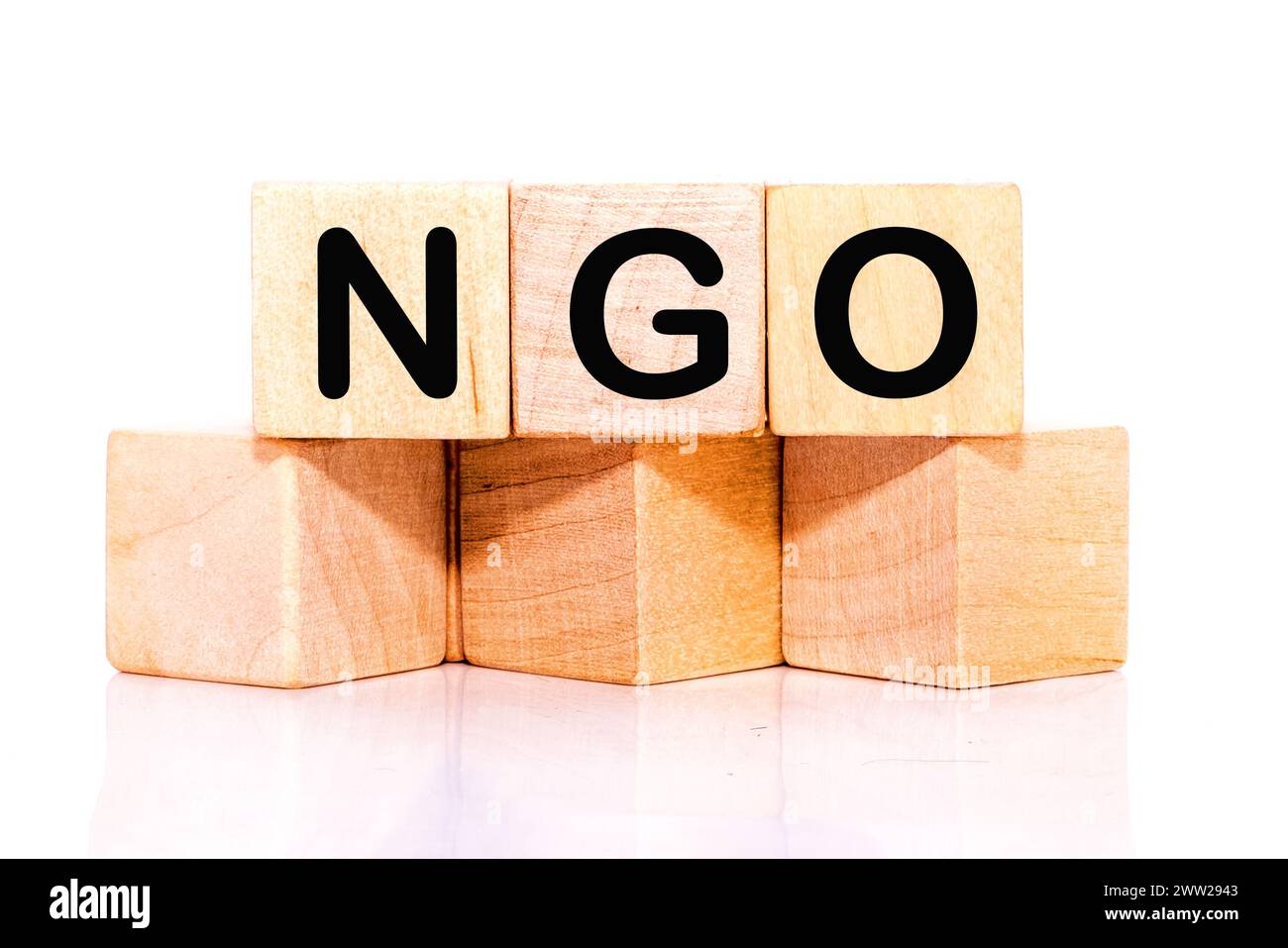 NGO (Non-Governmental Organization) sign on wooden cube Stock Photo