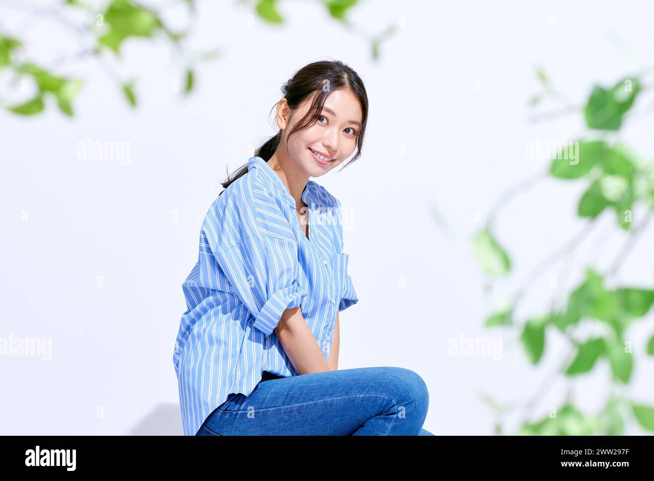 Asian woman sitting on ground hi-res stock photography and images - Alamy