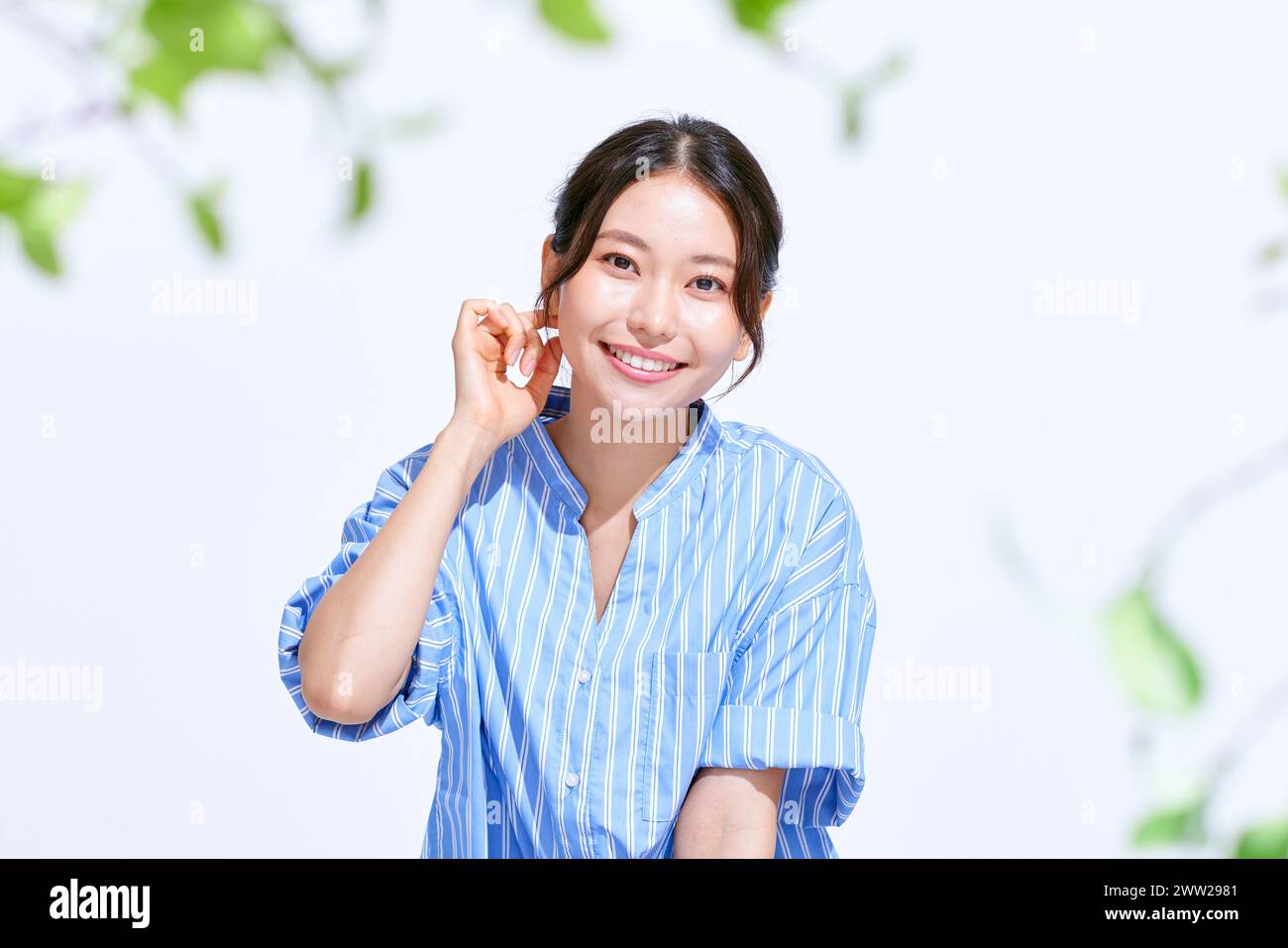 Woman in blue shirt hi-res stock photography and images - Alamy
