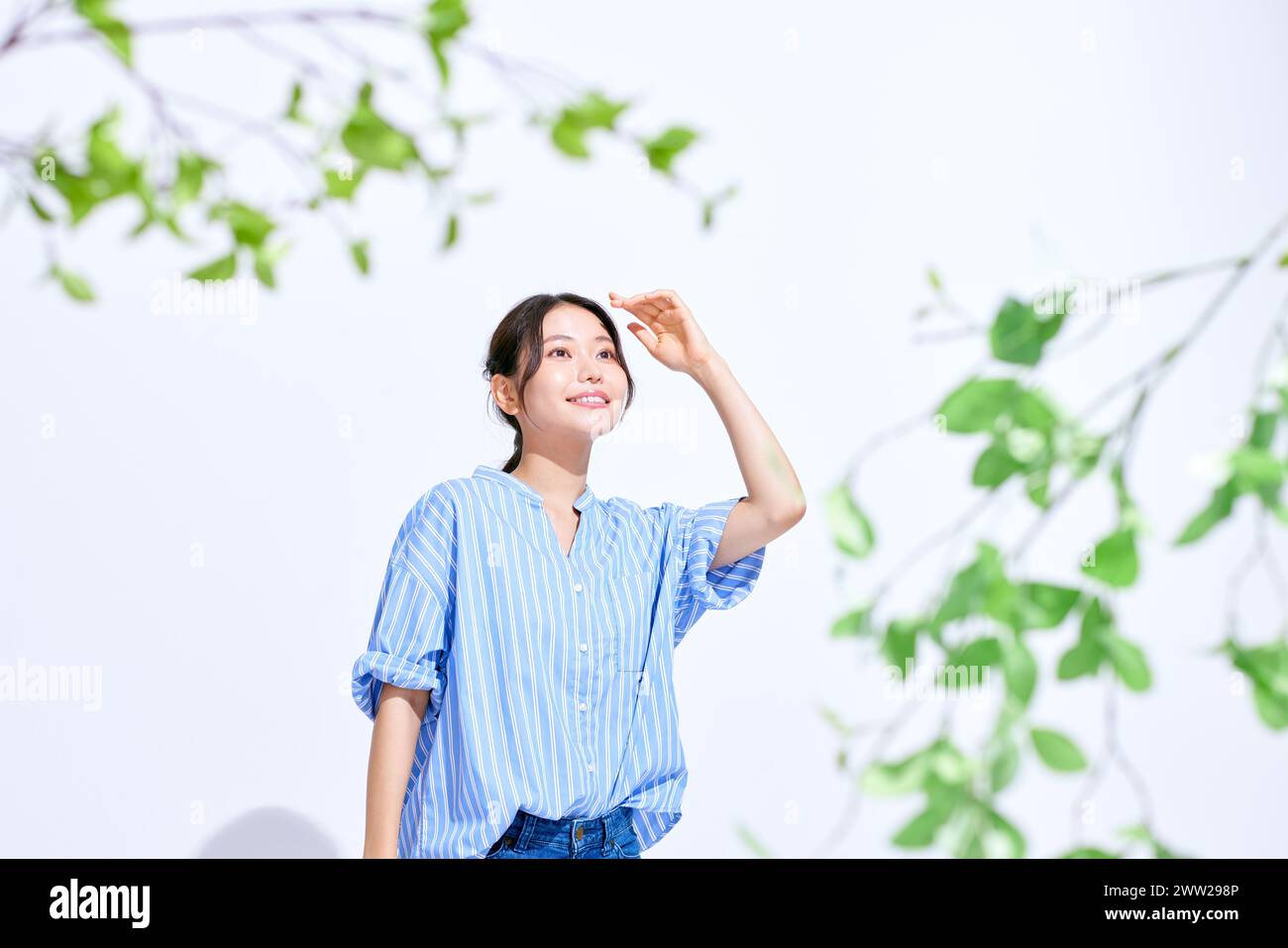 Woman in blue shirt hi-res stock photography and images - Alamy