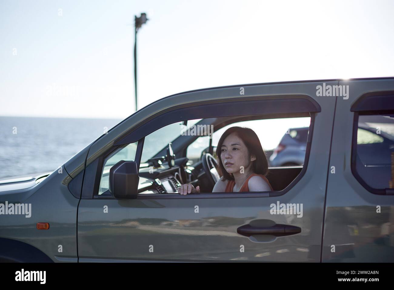 A woman driving a car Stock Photo