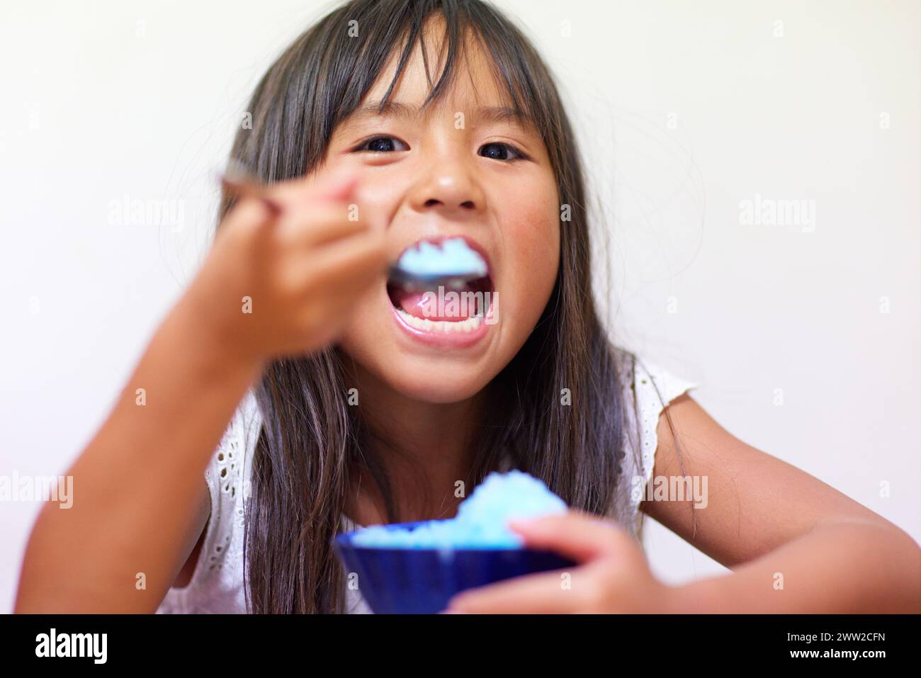 Kid eating shaved ice Stock Photo