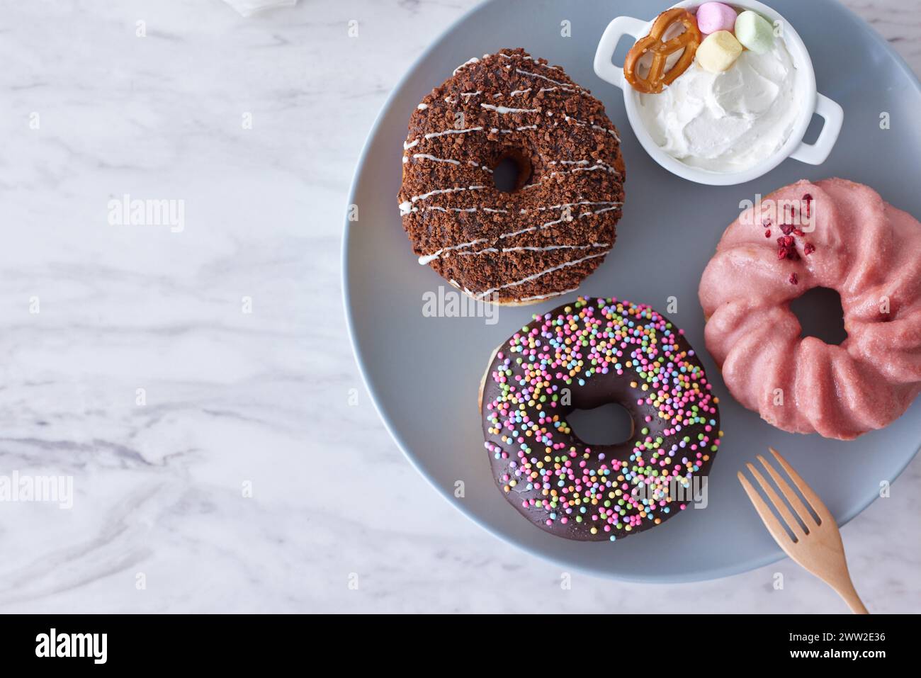 A group of donuts with different toppings Stock Photo