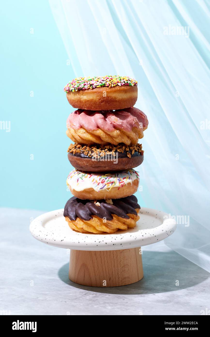 A stack of donuts on a white plate Stock Photo