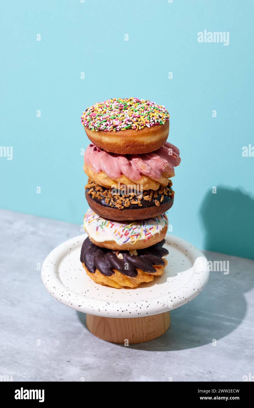 A stack of donuts on a white plate Stock Photo