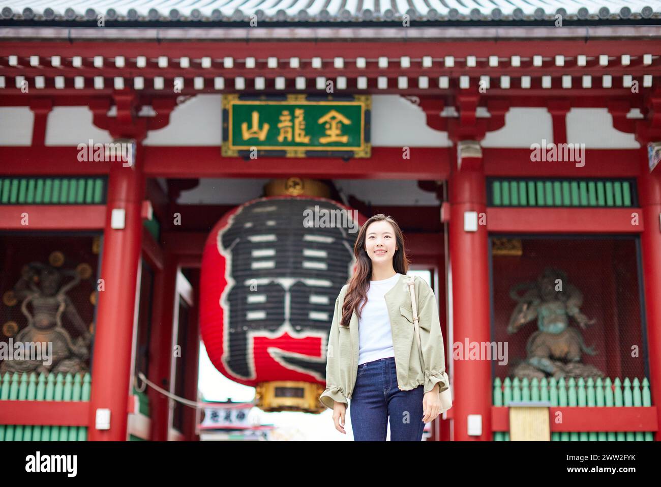 A woman standing in front of a temple Stock Photo