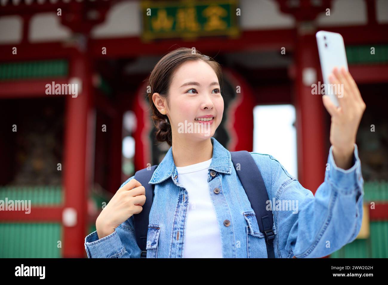 A woman taking a selfie with her phone Stock Photo