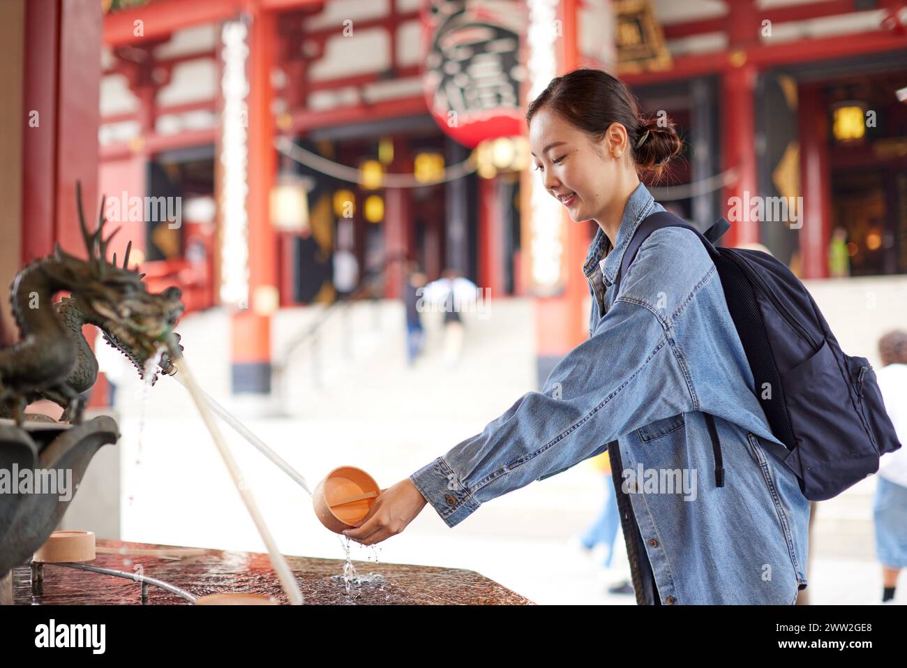 Asian woman at a temple Stock Photo