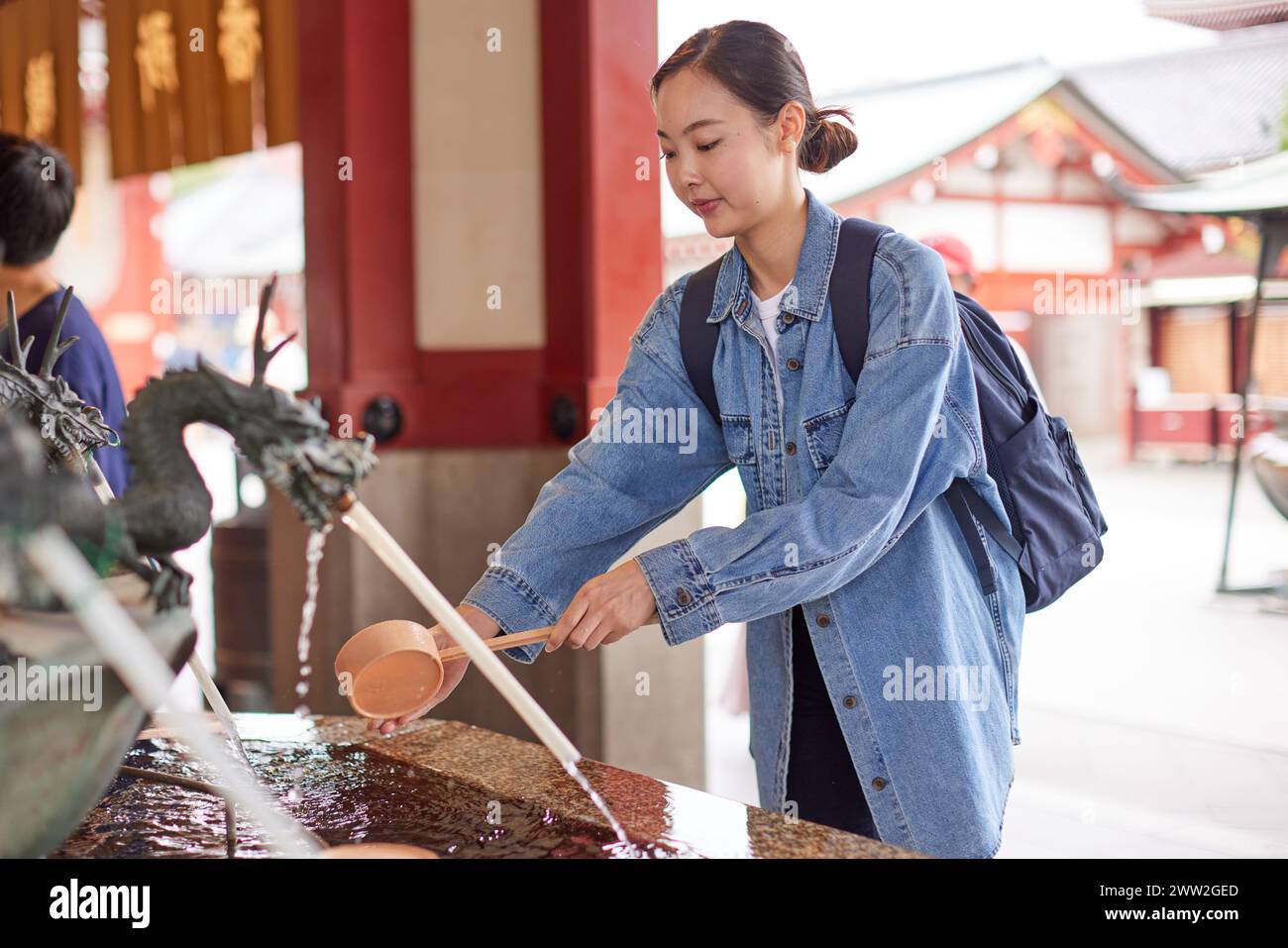 Asian woman at a temple Stock Photo