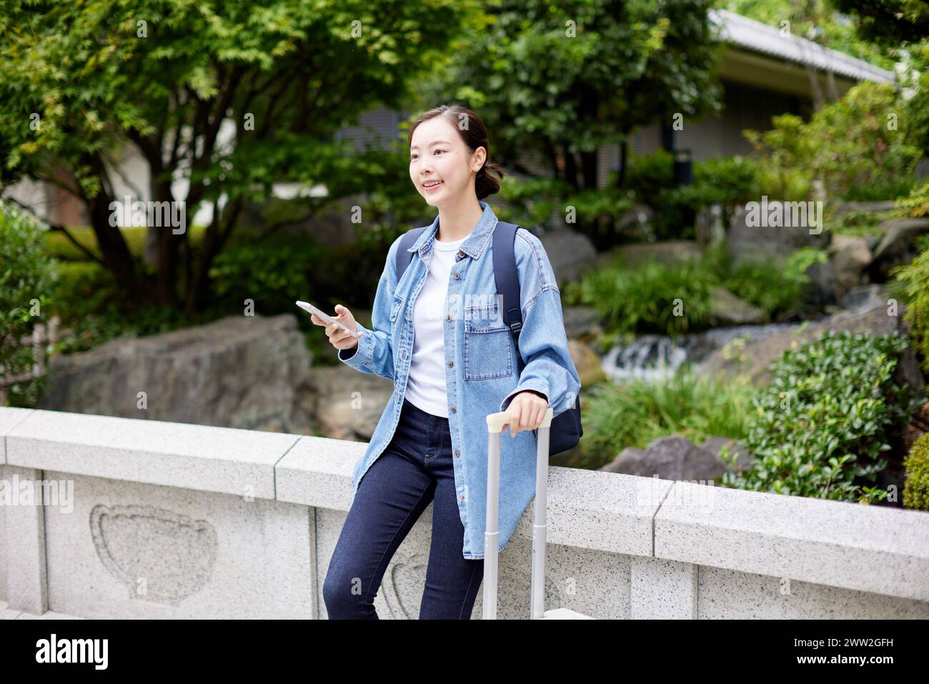 Asian woman using smartphone Stock Photo