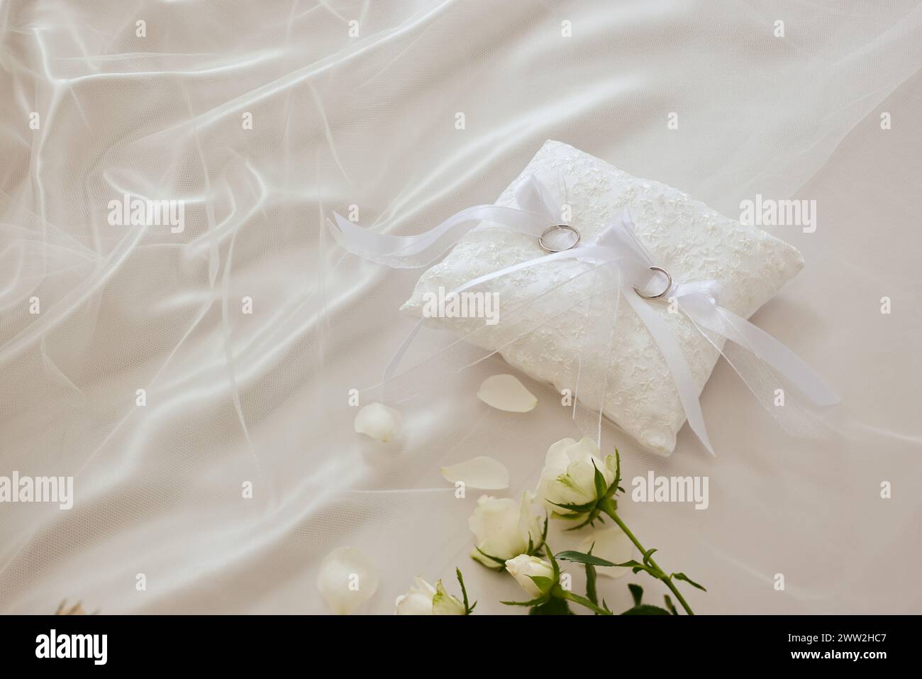 Wedding rings on a white pillow Stock Photo
